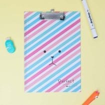 Tabla con aprieta papel diseño caritas