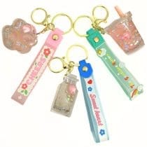 Llaveros con formas y brillo huellita, vasito y botella