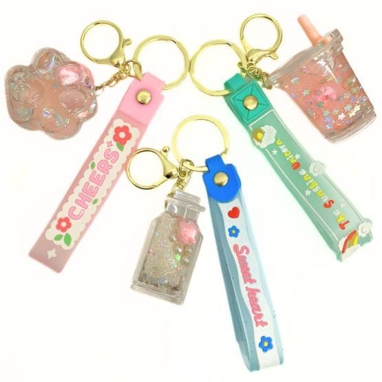 Llaveros con formas y brillo huellita, vasito y botella
