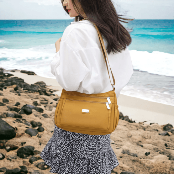 Cartera con bolsillos laterales varios colores