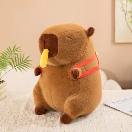Peluche capibara con mochila papas fritas 25cm